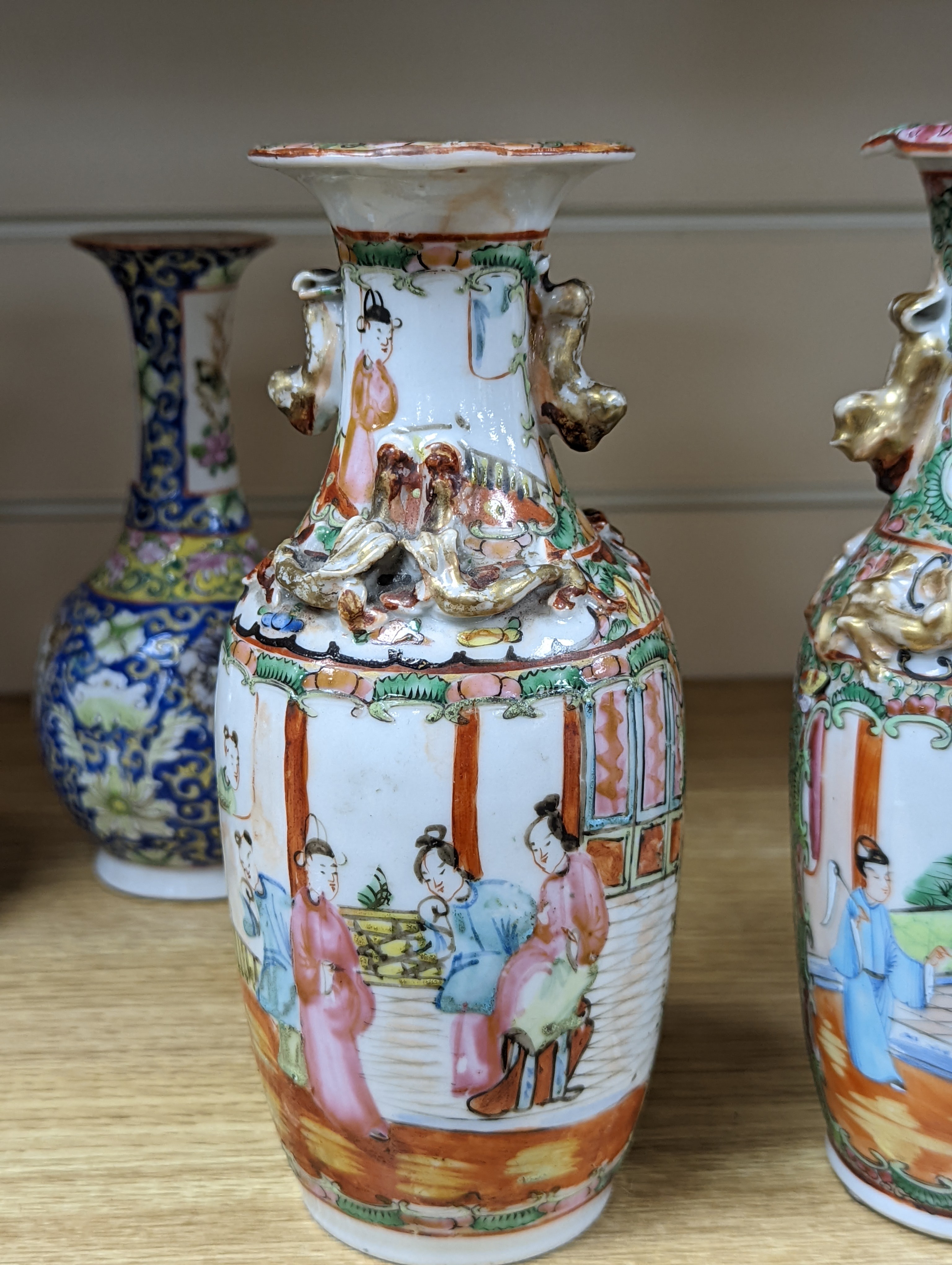 Four 19th century Chinese famille rose vases, 21cm